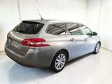 a picture of a silver car parked in a garage