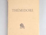 an old book with a picture of a man riding a horse on it