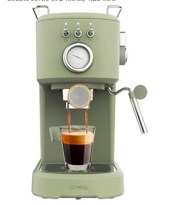 an image of a green coffee machine with a cup of coffee