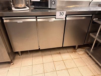 a kitchen with stainless steel appliances and a microwave