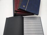 a stack of four notebooks sitting on top of each other