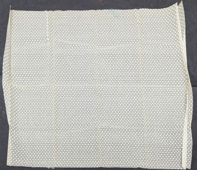 a piece of white cloth with small white dots on it