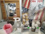 a table with various items on it in front of a mirror