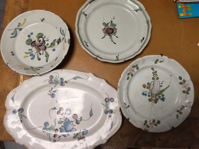 four plates that are sitting on a table