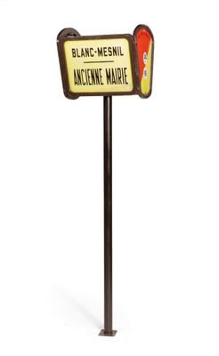 a sign that says blanc - mesnel and is on a pole