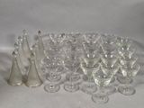 a lot of wine glasses that are sitting on a table