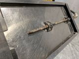 a metal door that has a latch on it