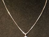 a close up of a necklace on a mannequin mannequin