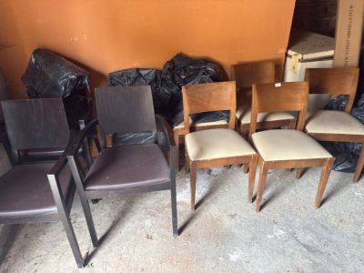 four chairs that are sitting in the middle of a room