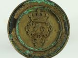 an image of a gold plate with a crown on top of it