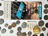a book on the table surrounded by coins