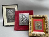 three framed pictures of a man and a woman on a table
