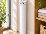 an image of a white air purifier in a living room