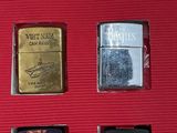 a picture of a collection of lighters in a red box