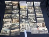 several old black and white photographs of people and buildings on a table