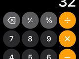 a close up of a calculator on a black background
