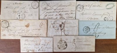 several old envelopes are sitting on a table with writing on them