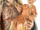 an image of a statue of a woman holding a baby in her arms