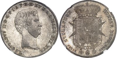 a close up of a silver coin with a crown on it