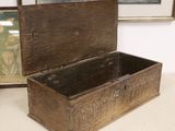 a small wooden box sitting on a table next to a painting