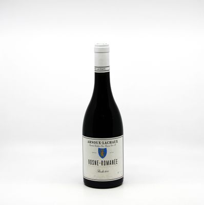 a bottle of wine that is sitting on a table
