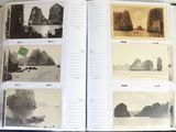 a book with pictures of mountains and boats on the pages