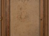 an old picture of a wooden frame with a picture on it
