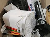 a cardboard box filled with electronics and other items