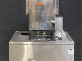 a machine that has a basket on top of it