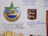 many badges on a piece of paper with writing on it
