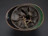a close up of a helmet on a black surface