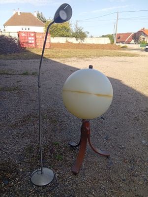 a large white object on a stand in the middle of the road