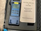 a box with a calculator and a notepad in it