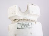 a close up of a white bottle with a label on it
