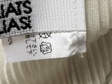 a label on the top of a hat that says haas blas