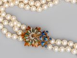 two strand pearl necklace with multicolored flower broocher