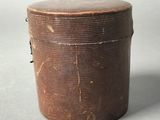 an old wooden box sitting on top of a gray surface