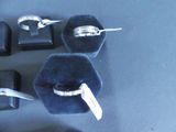 three rings and a pair of scissors sitting on a table