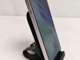 a cell phone that is sitting on a stand
