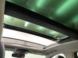 a view of the sunroof from inside of a car