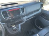 a dashboard of a car with a radio and a steering wheel