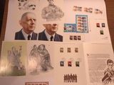 a lot of stamps on the table with pictures on them