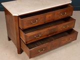 an image of a marble top chest of drawers in a room
