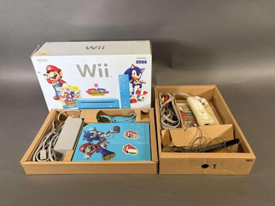 Console de jeux Nintendo Wii avec Mario Kart et accessoires, dans une boîte en carton