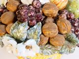 a close up of a basket of fruit and nuts