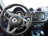 dashboard view of a car with a steering wheel and dashboard controls