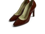 the woman ' s shoes are brown and brown on a white background