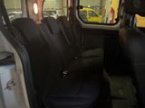 a picture of the inside of a vehicle with the seats folded down