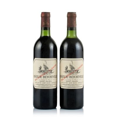 two bottles of red wine sitting next to each other on a white surface