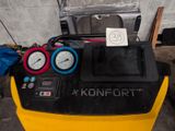 two gauges on the side of a yellow machine